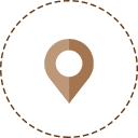 A brown map pin in the middle of a circle.
